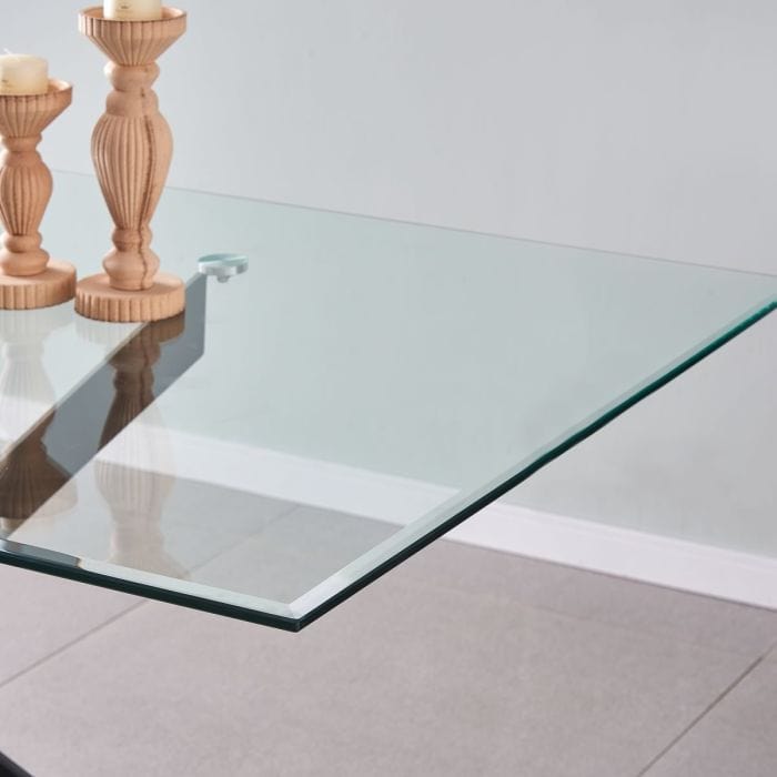 Table à manger en verre rectangulaire de 150 cm - Amara avec des jambes transversales en métal noir